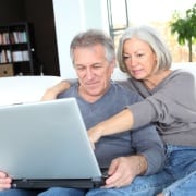 Senior couple surfing on internet at home Lower Taxes are Another Reason to Retire in NC